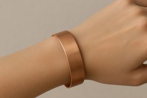 Handcrafted copper bracelet with warm reddish-brown glow