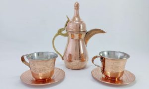 Handcrafted copper serving ware with intricate design