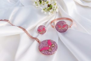 Soft cloth buffing a copper bracelet to restore its shine