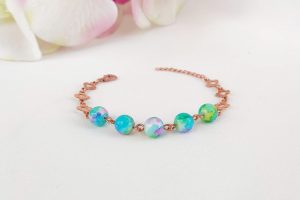 Tarnished copper bracelet showing dull patina before cleaning process