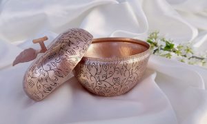 Antique copper sugar bowl with engraved patterns