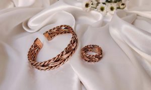 Polished copper pendant necklace with healing properties